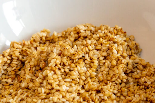 Sesame seeds toasted with butter to cool in a bowl.