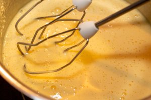 Beat the cooled egg mixture until creamy with a hand mixer.