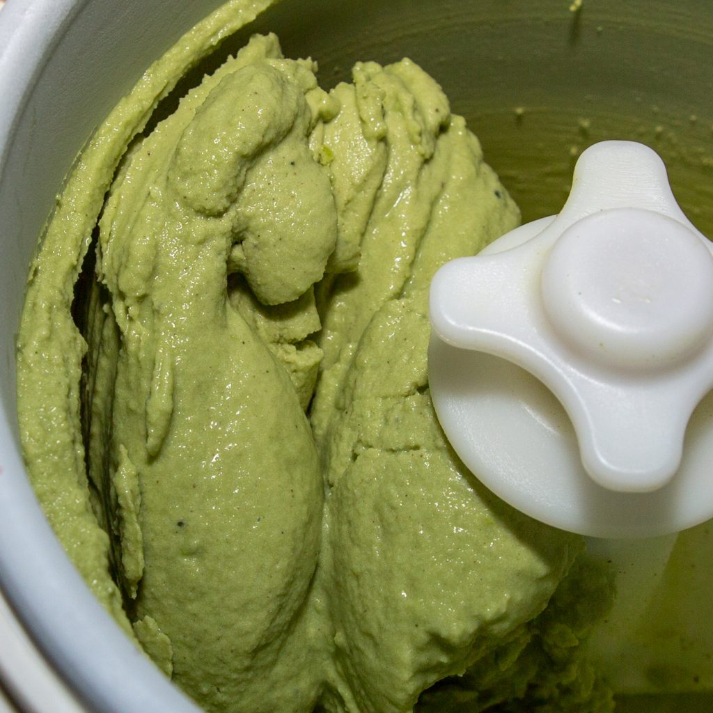 Matcha ice cream after the freezing process in the ice cream machine.