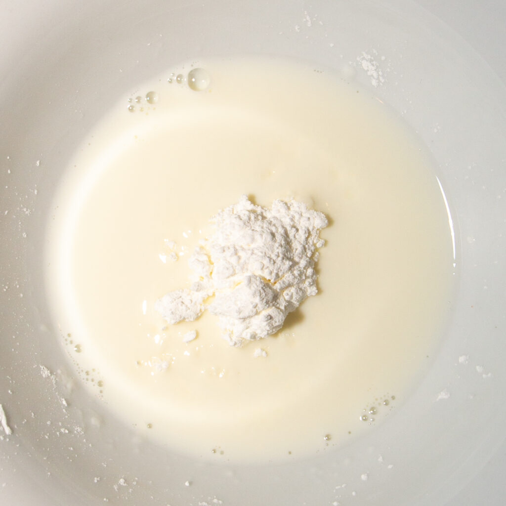 Dissolve the starch in a few tablespoons of cold milk.