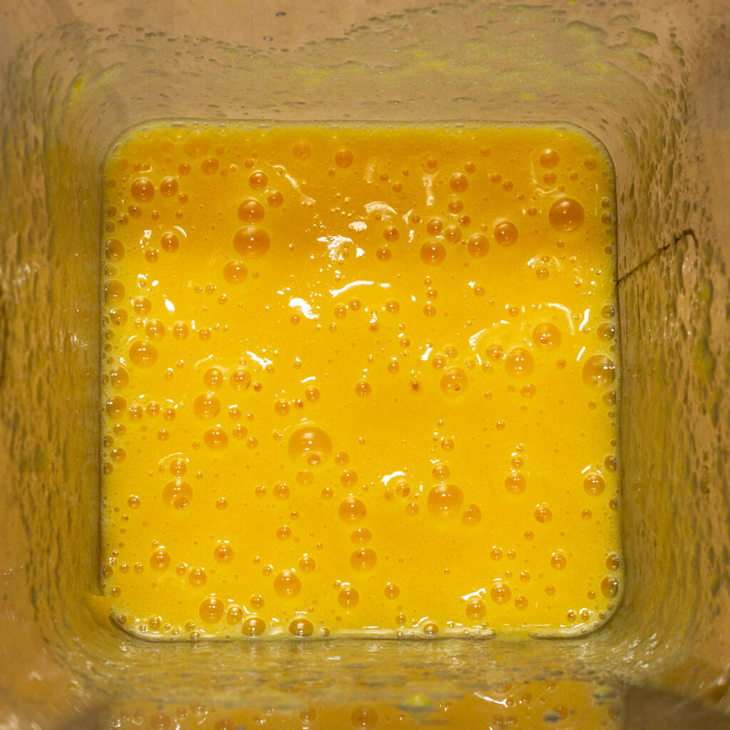 The peach ice cream mixture after mixing.