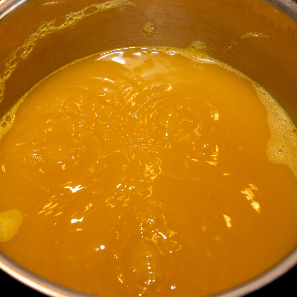 The passion fruit juice is reduced by half by boiling down.