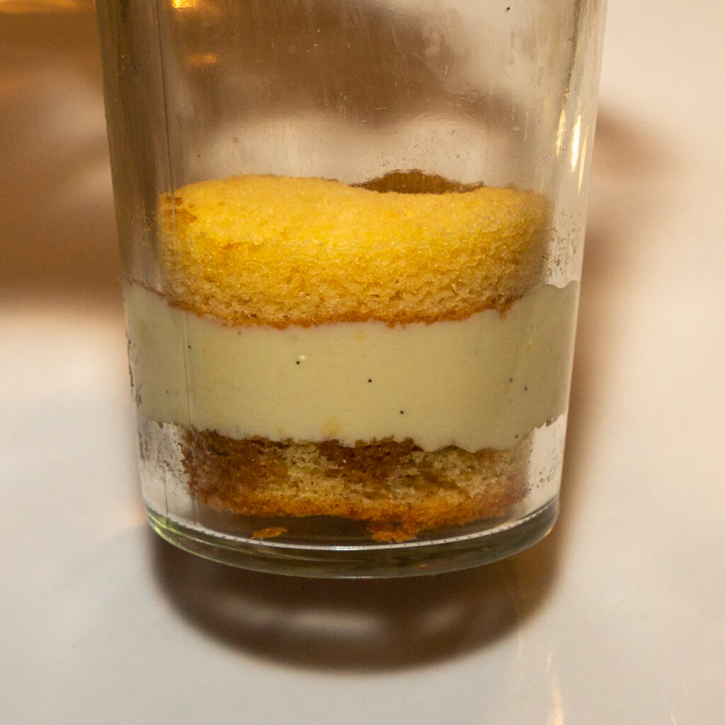 Follow with a layer of ice cream mixture, then sponge cake again. Then drizzle again with espresso amaretto.