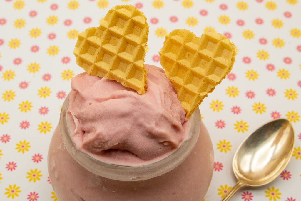 Raspberry ice cream Creamy raspberry ice cream decorated with cut out wafer hearts.