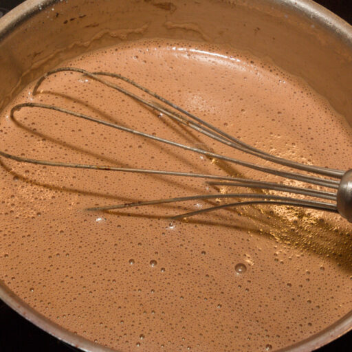 Heat the ingredients, stirring constantly, until the sugar has dissolved.