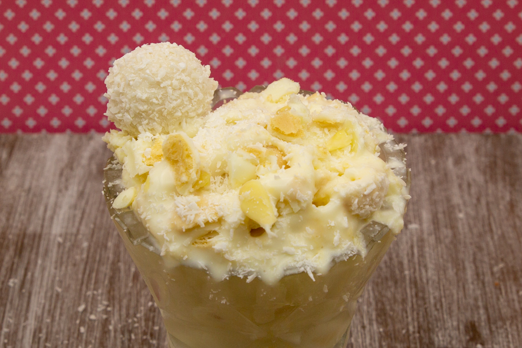 Creamy raffaello ice cream with coconut milk, white chocolate, almond paste and chopped raffaellos.